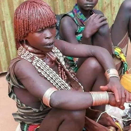 Hamar woman in Omo Valley adorned with beads and ochre – celebrating cultural pride